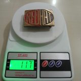 Red Hat vintage belt buckle – on scale showing weight