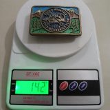 Rocky Mountain Master Mechanics 1974 vintage belt buckle – on scale showing weight