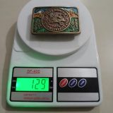 Rocky Mountain Master Mechanics 1974 vintage belt buckle – on scale showing weight