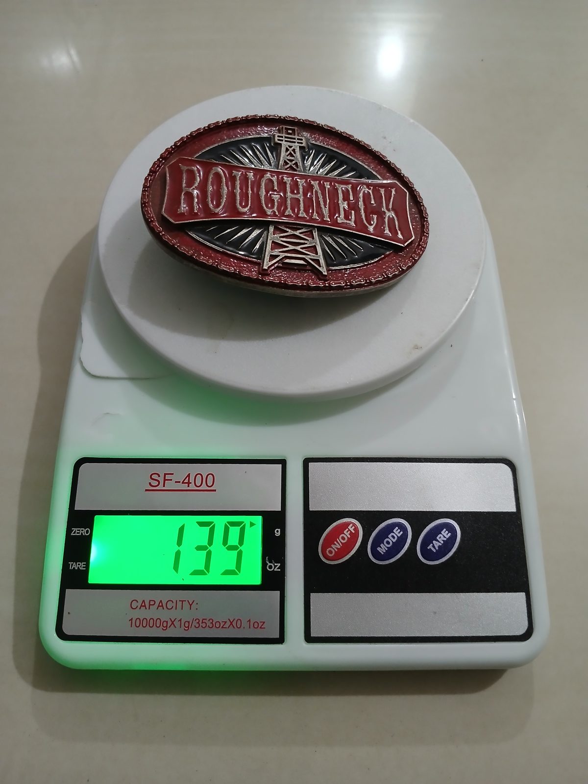Roughneck Oil Derrick Vintage Belt Buckle – On scale showing weight Roughneck Oil Derrick vintage belt buckle – on scale showing weight
