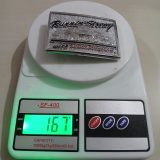 Runnin Strong Snap-on vintage belt buckle – on scale showing weight