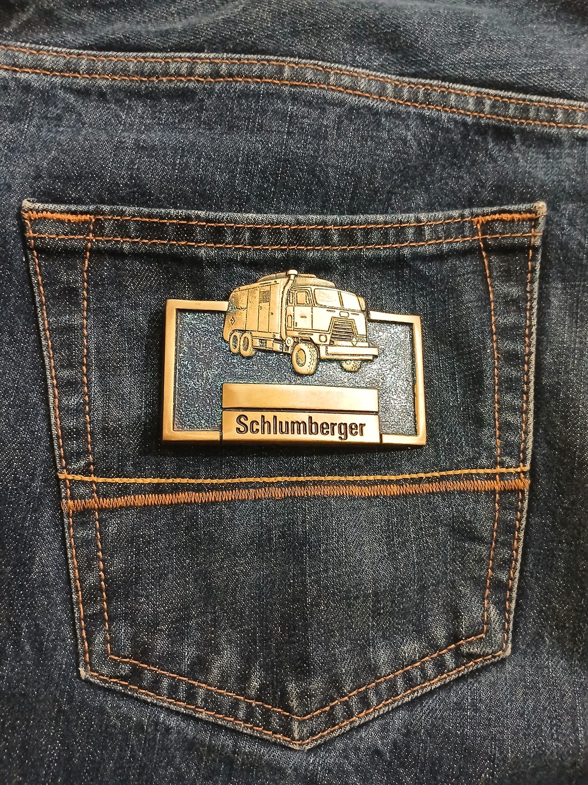 Schlumberger Truck Vintage Belt Buckle – On jeans back pocket Schlumberger Truck vintage belt buckle – on jeans back pocket