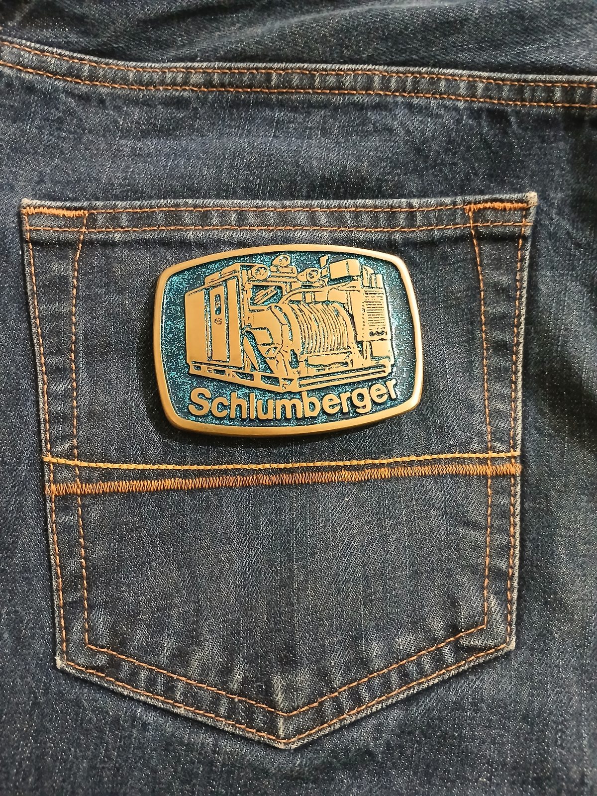 Schlumberger Truck Vintage Belt Buckle – On jeans back pocket Schlumberger Truck vintage belt buckle – on jeans back pocket