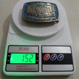 Schlumberger Truck vintage belt buckle – on scale showing weight