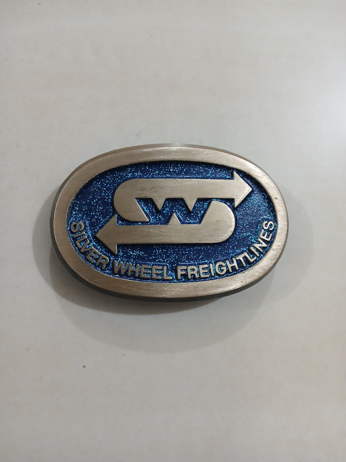 Silver Wheel Freightlines Vintage Belt Buckle – Front view Silver Wheel Freightlines vintage belt buckle – front view