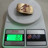 Skier vintage belt buckle – on scale showing weight