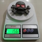 Skull Crossbones vintage belt buckle – on scale showing weight