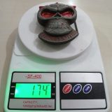 Skull Red Eyes vintage belt buckle – on scale showing weight