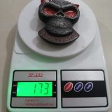 Skull Red Eyes vintage belt buckle – on scale showing weight