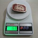 Smile-A-Milers vintage belt buckle – on scale showing weight