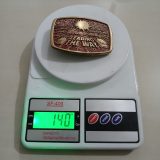 Snap-on Leading The Way vintage belt buckle – on scale showing weight
