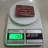 South Carolina vintage belt buckle – on scale showing weight