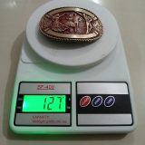 Square Dancers vintage belt buckle – on scale showing weight
