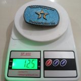 Texaco Trading and Transportation vintage belt buckle – on scale showing weight