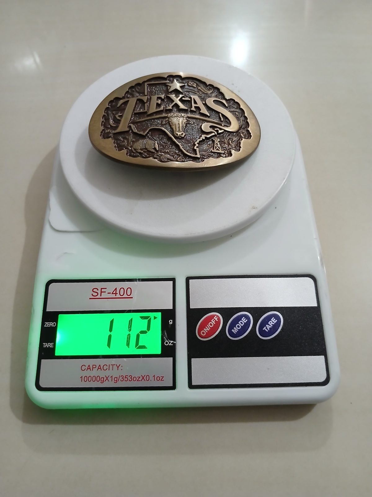 Texas Longhorn Map Vintage Belt Buckle – On scale showing weight Texas Longhorn Map vintage belt buckle – on scale showing weight