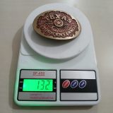 Texas Sesquicentennial 1836-1986 vintage belt buckle – on scale showing weight