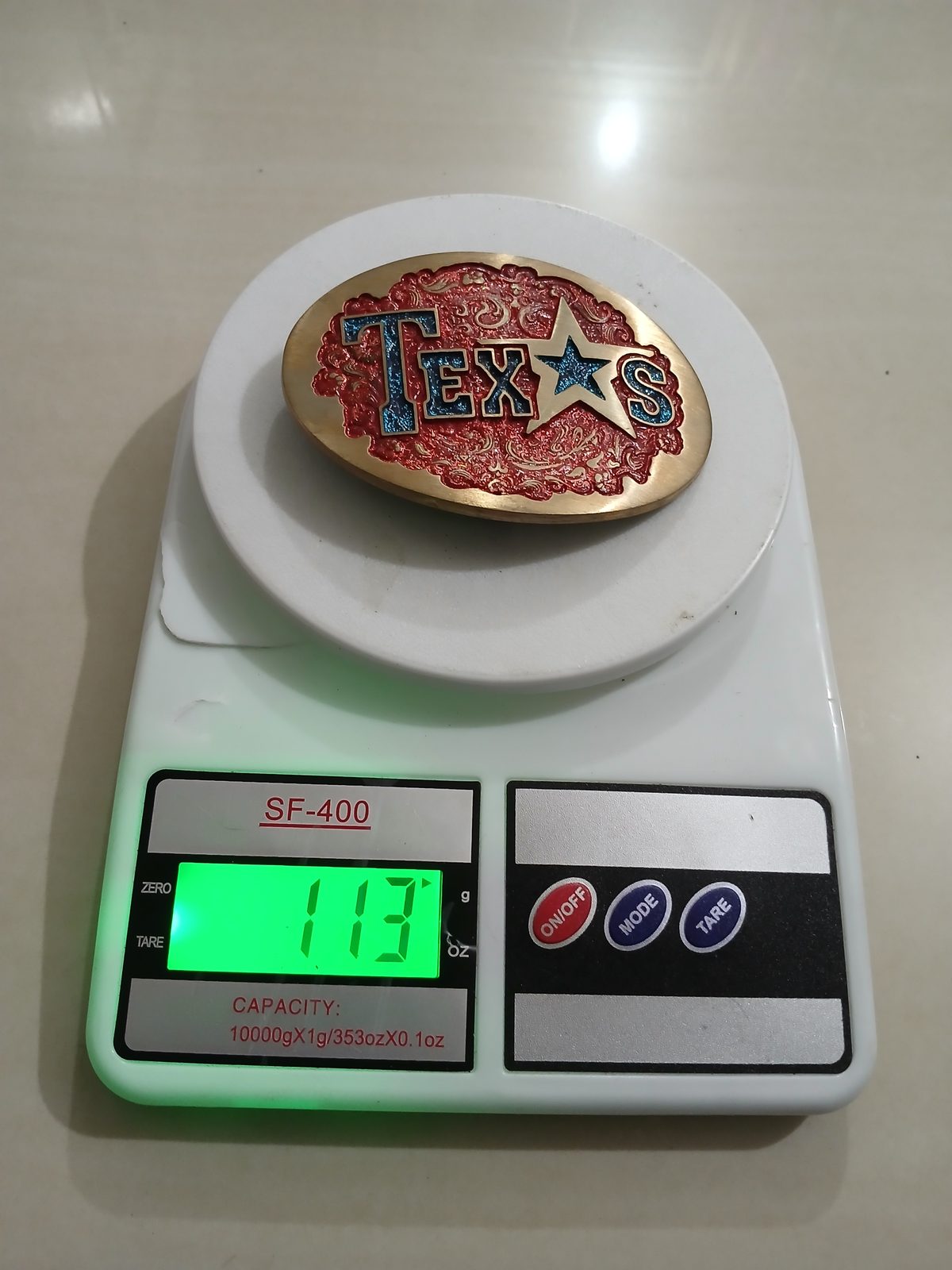 Texas Star Vintage Belt Buckle – On scale showing weight Texas Star vintage belt buckle – on scale showing weight