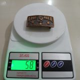 The Bee vintage belt buckle – on scale showing weight