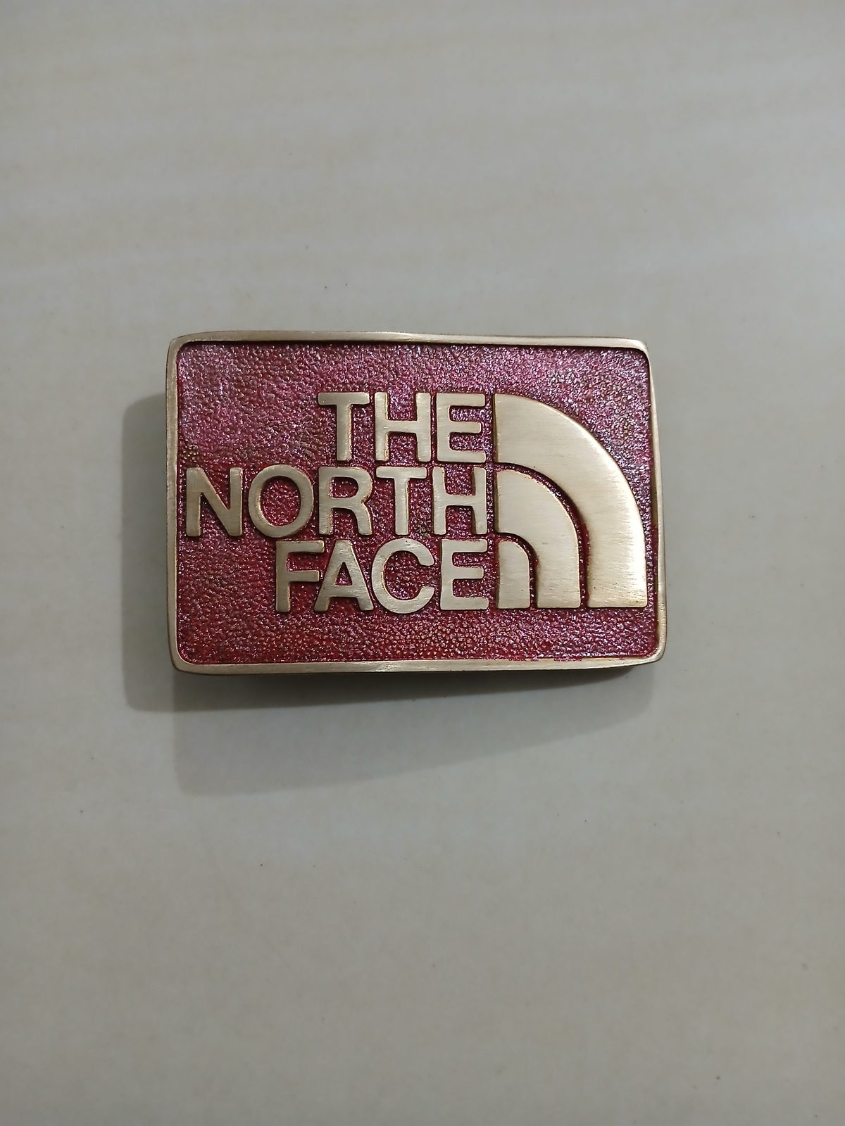 The North Face Vintage Belt Buckle – Front view The North Face vintage belt buckle – front view