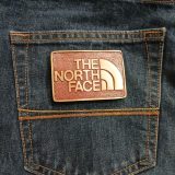 The North Face vintage belt buckle – on jeans back pocket