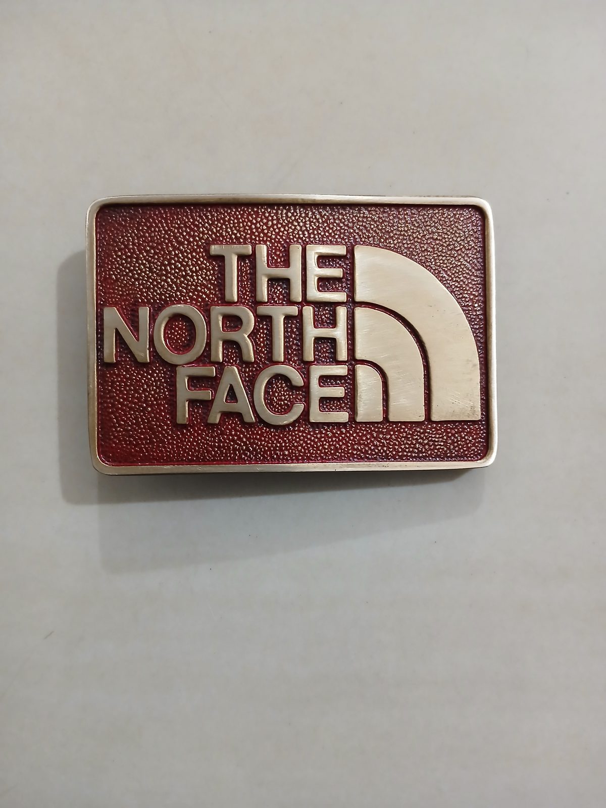 The North Face Vintage Belt Buckle – Front view The North Face vintage belt buckle – front view