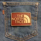 The North Face vintage belt buckle – on jeans back pocket