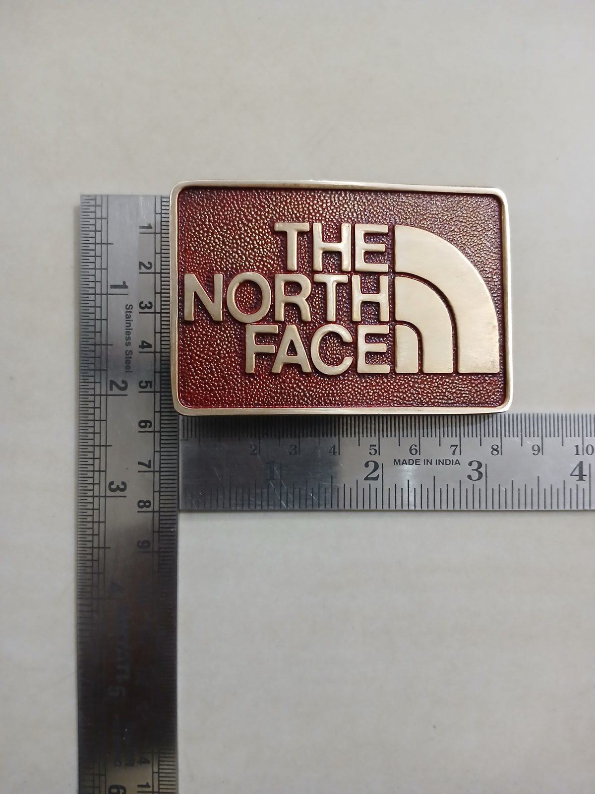 The North Face Vintage Belt Buckle – With ruler for size The North Face vintage belt buckle – with ruler for size