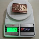 The North Face vintage belt buckle – on scale showing weight