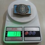 Titan Silver Anniversary 1959-1984 vintage belt buckle – on scale showing weight