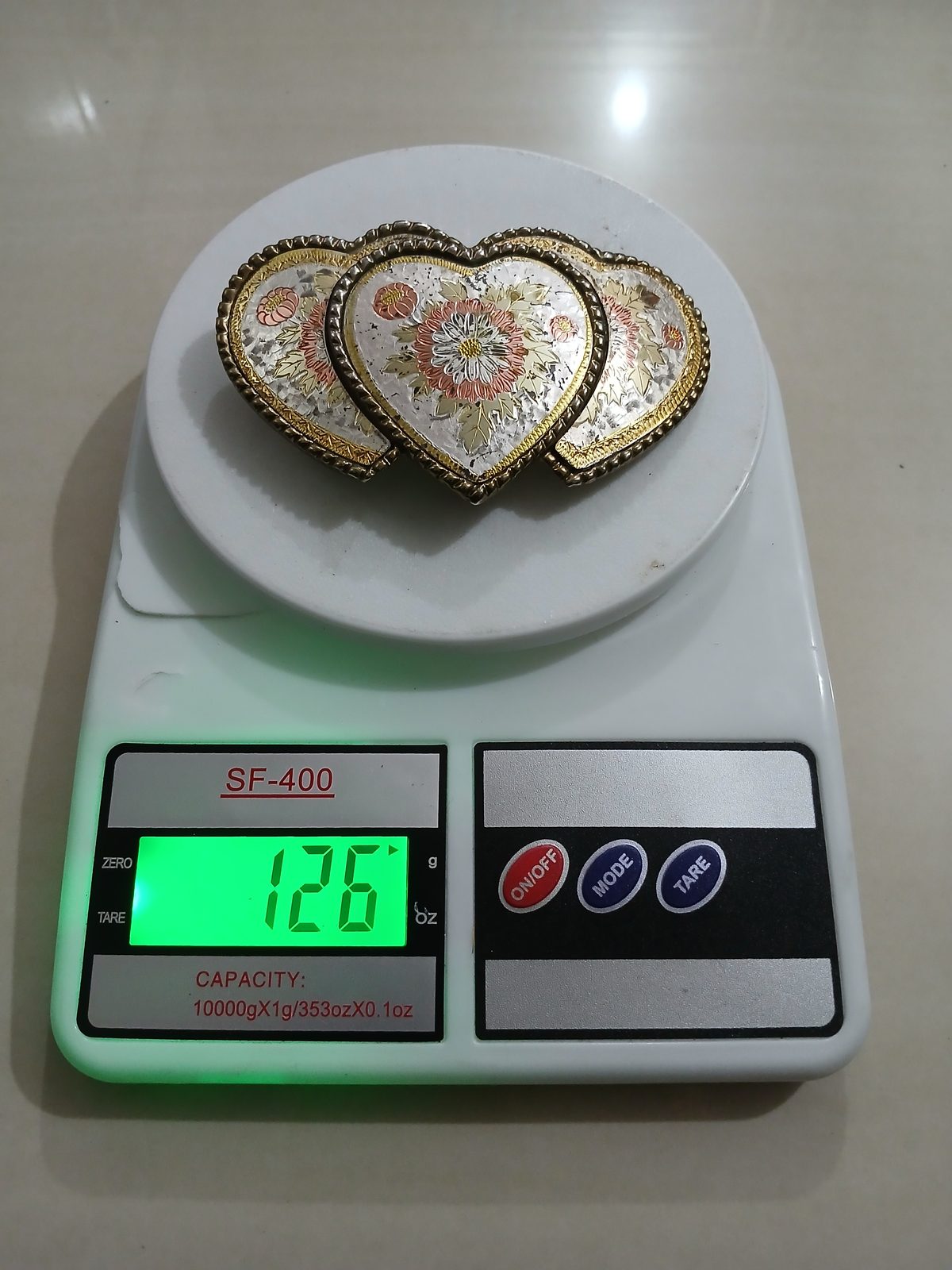 Triple Heart Floral Vintage Belt Buckle – On scale showing weight Triple Heart Floral vintage belt buckle – on scale showing weight