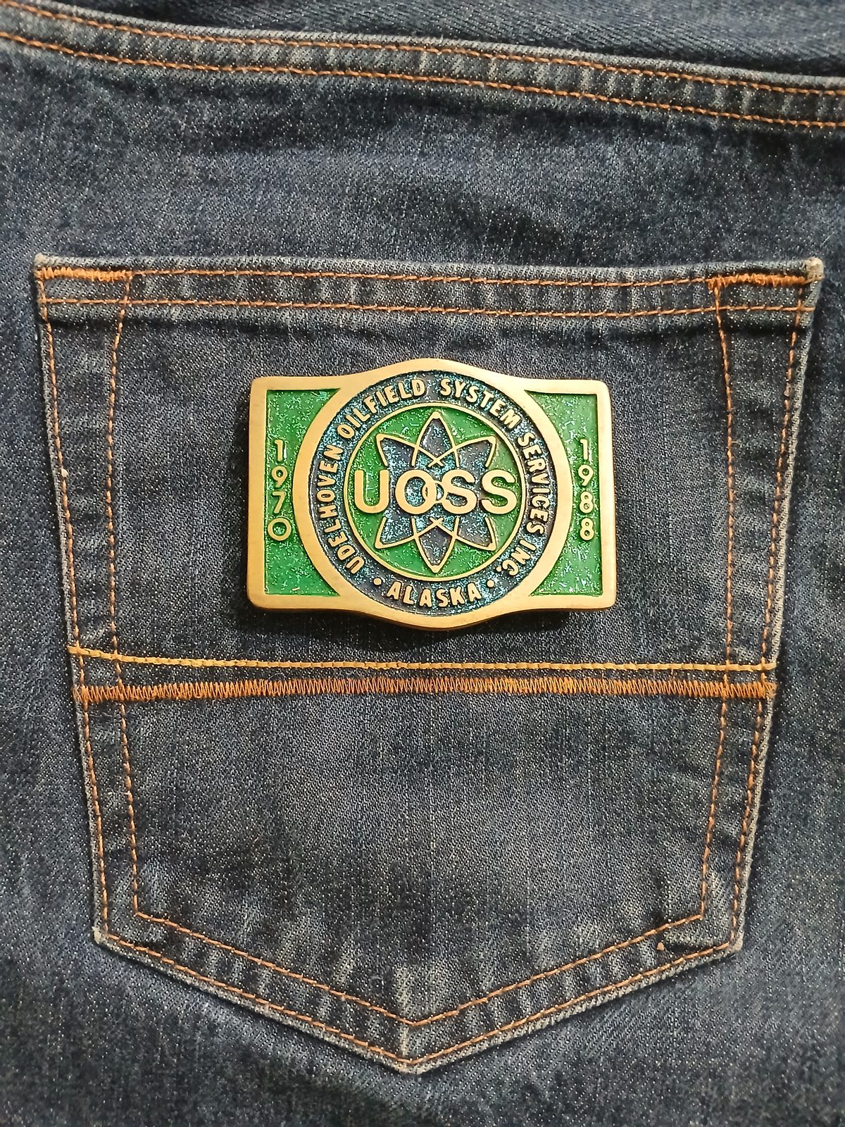 UOSS Udelhoven Oilfield Alaska Vintage Belt Buckle – On jeans back pocket UOSS Udelhoven Oilfield Alaska vintage belt buckle – on jeans back pocket