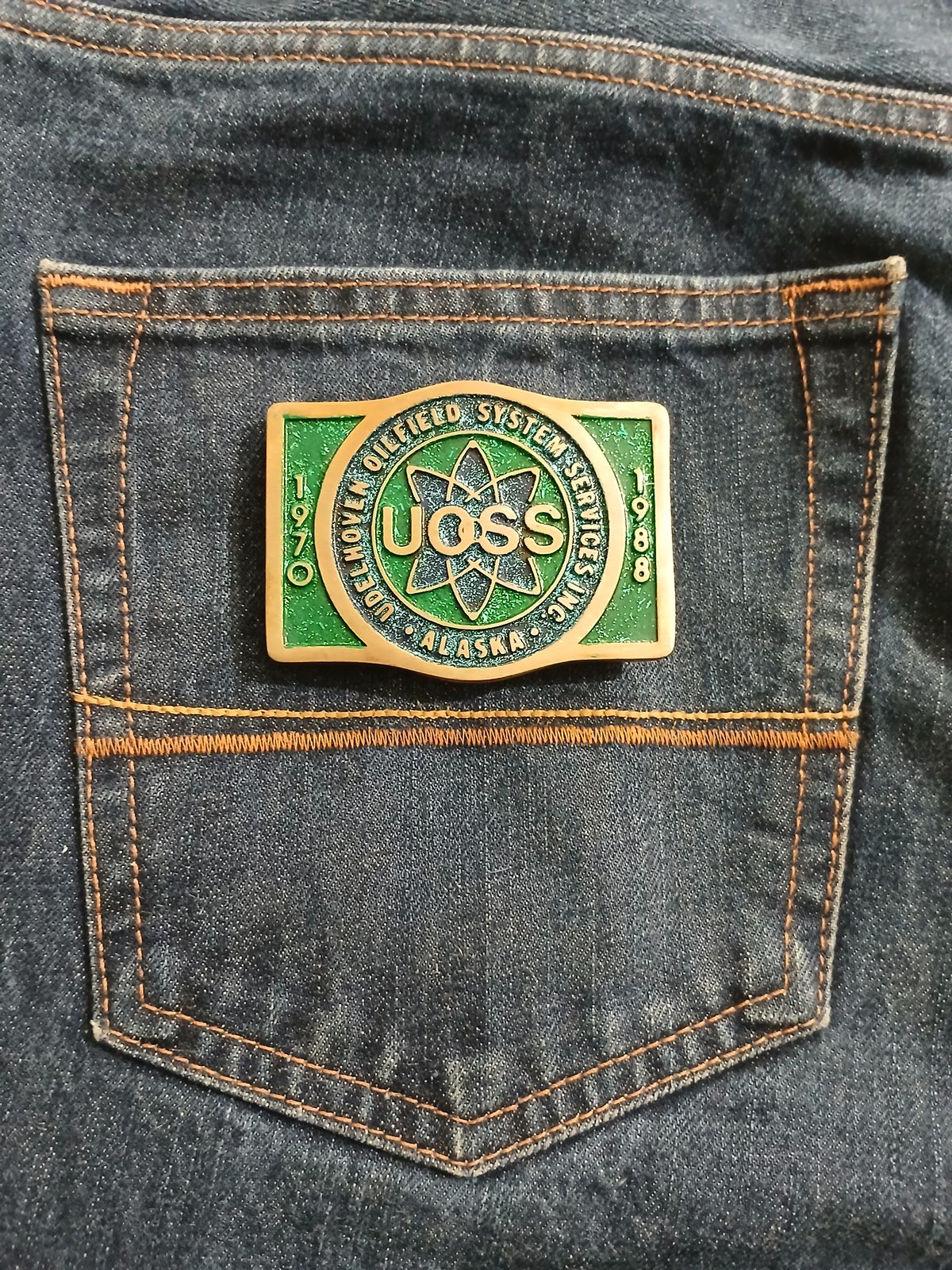 UOSS Udelhoven Oilfield Alaska Vintage Belt Buckle – On jeans back pocket UOSS Udelhoven Oilfield Alaska vintage belt buckle – on jeans back pocket