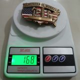 USA Flag Oil Rigs vintage belt buckle – on scale showing weight