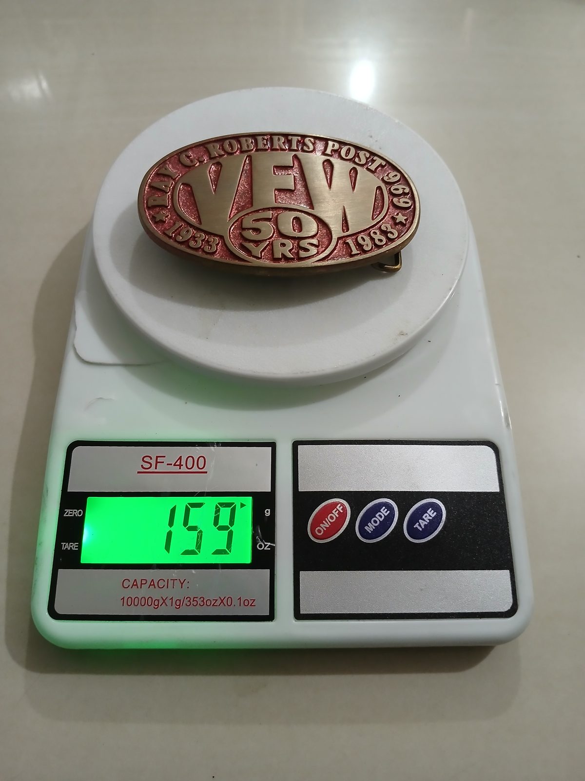 VFW 50 Years 1933-1983 Vintage Belt Buckle – On scale showing weight VFW 50 Years 1933-1983 vintage belt buckle – on scale showing weight