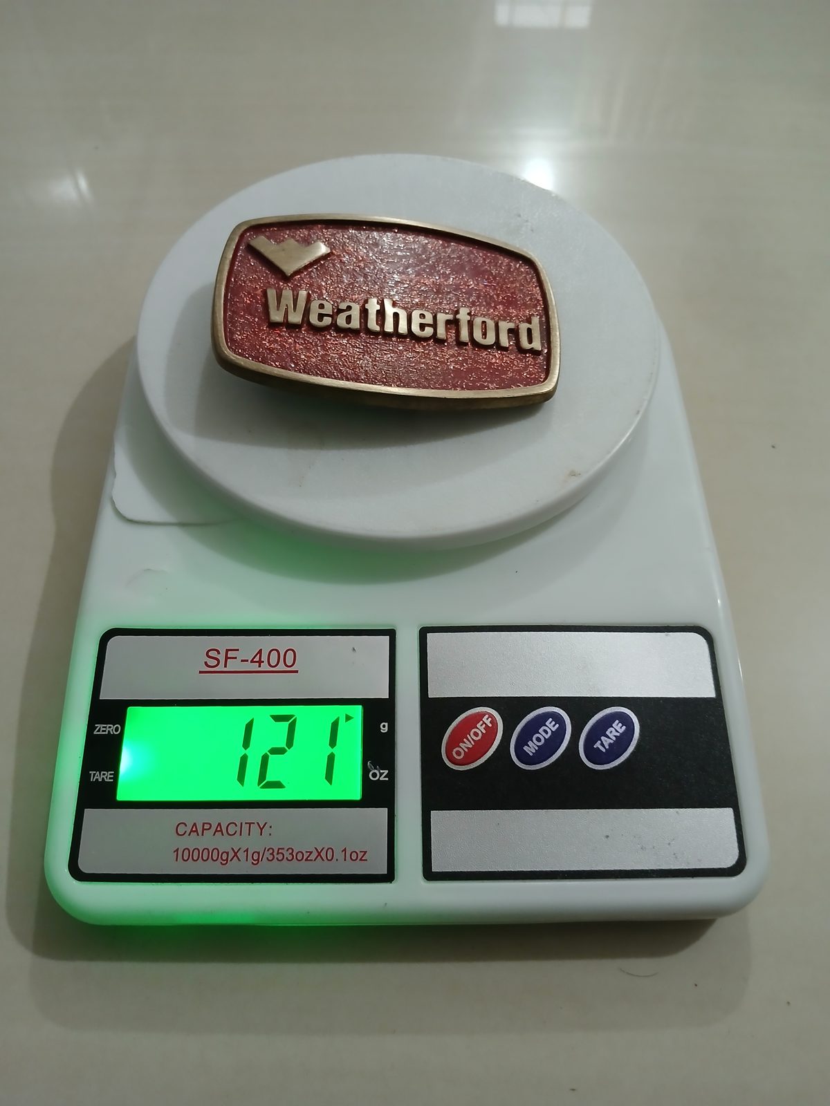 Weatherford Vintage Belt Buckle – On scale showing weight Weatherford vintage belt buckle – on scale showing weight