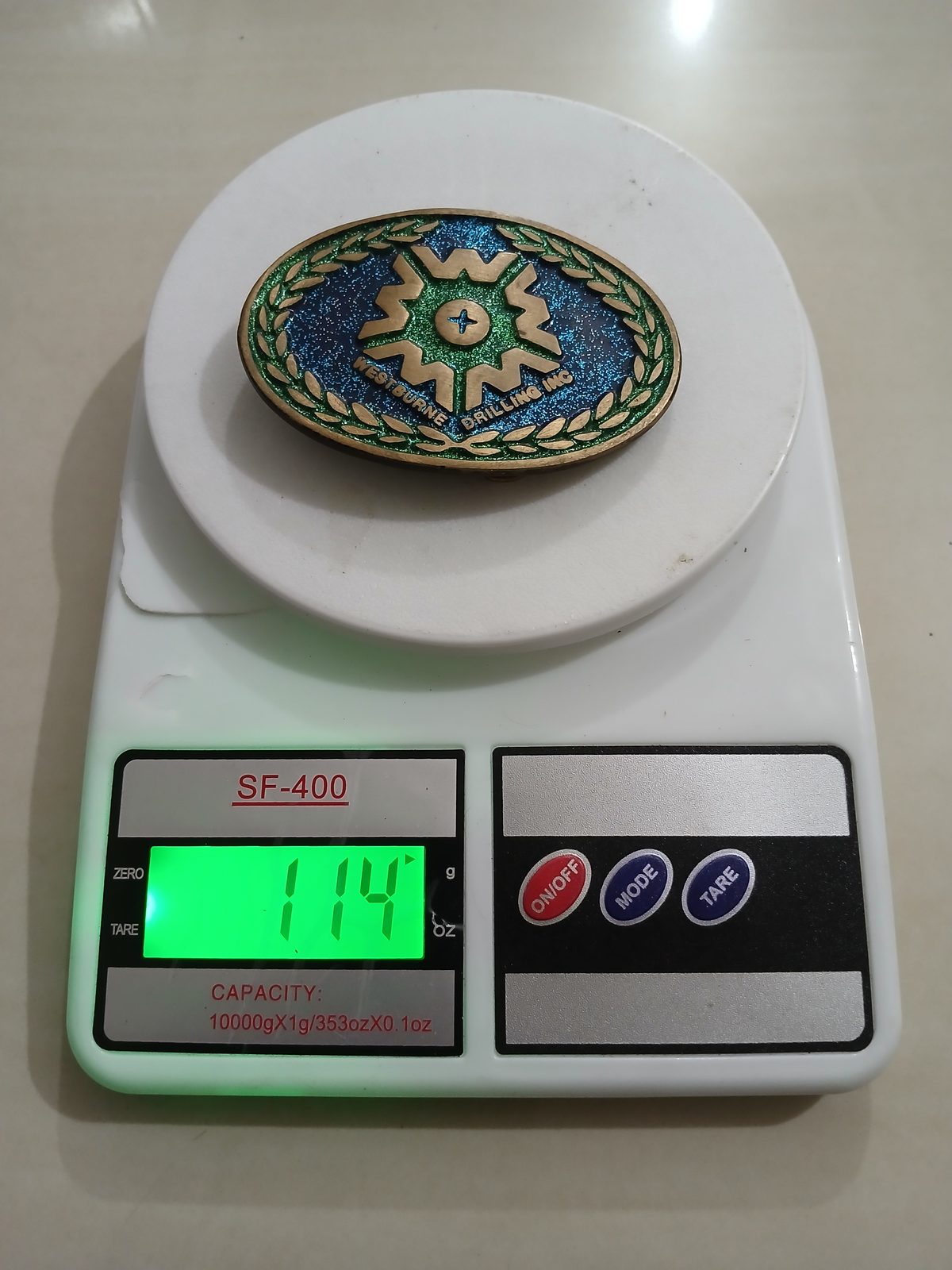 Westburne Drilling Inc Vintage Belt Buckle – On scale showing weight Westburne Drilling Inc vintage belt buckle – on scale showing weight
