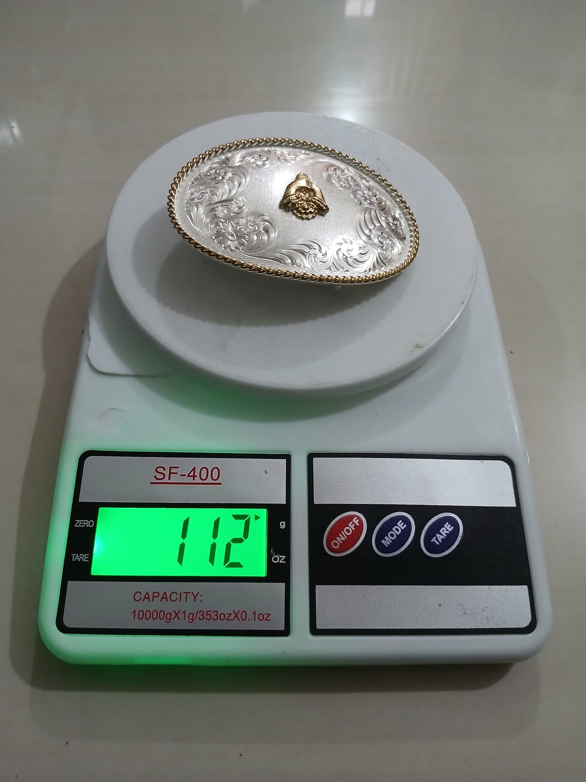 Western Silver Engraved Vintage Belt Buckle – On scale showing weight Western Silver Engraved vintage belt buckle – on scale showing weight