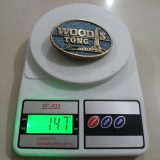 Woods Tong Service vintage belt buckle – on scale showing weight